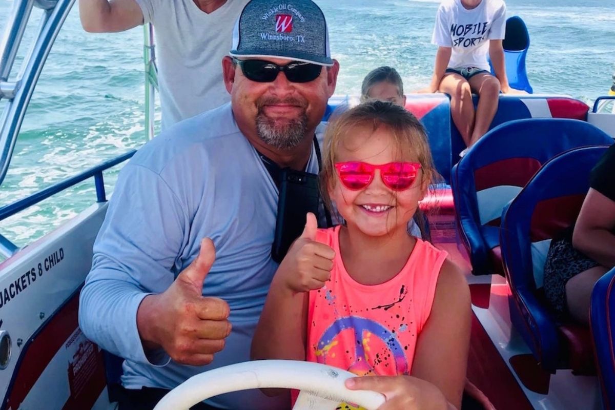 Child having fun searching for dolphins in Destin