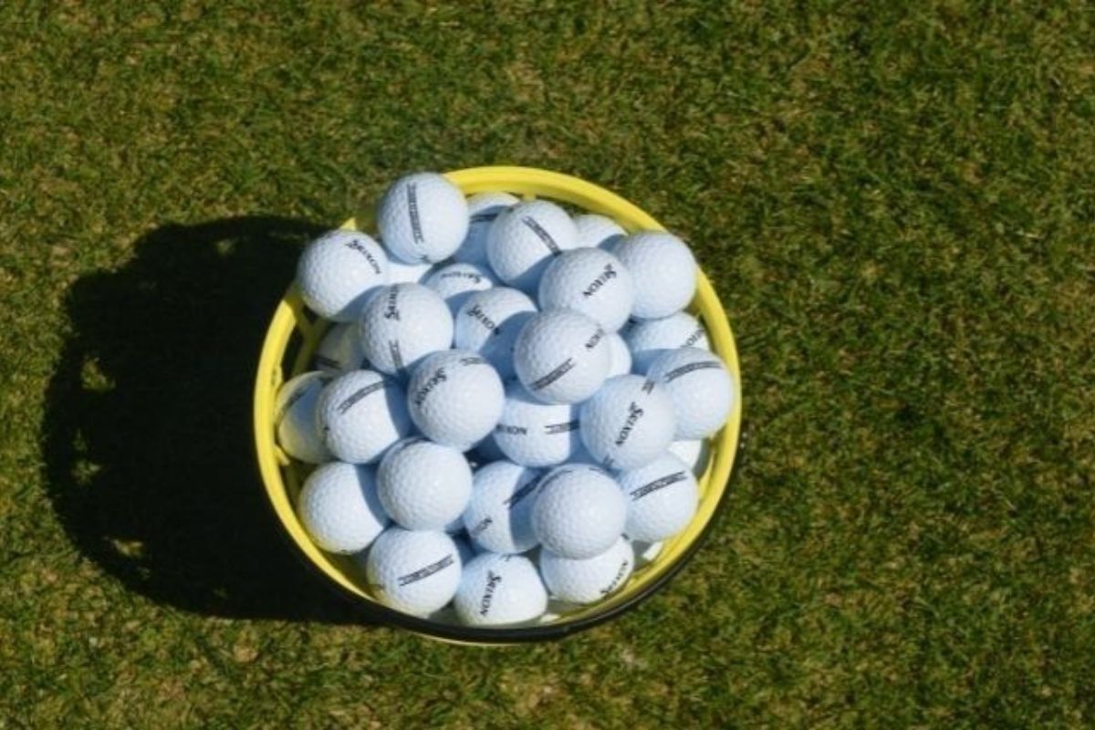bucket of golf balls at a Destin-FWB driving range