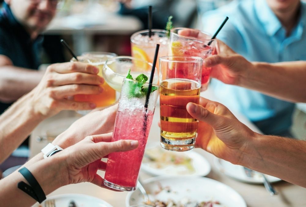 group makes a toast at Baytowne Wharf